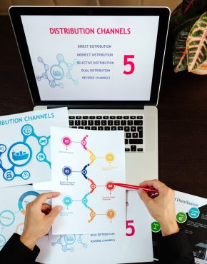 marketing distribution channels plan on office desk marketing distribution channels plan on office desk. Marketing manager desk with plans and strategy of distributive channels for new product.